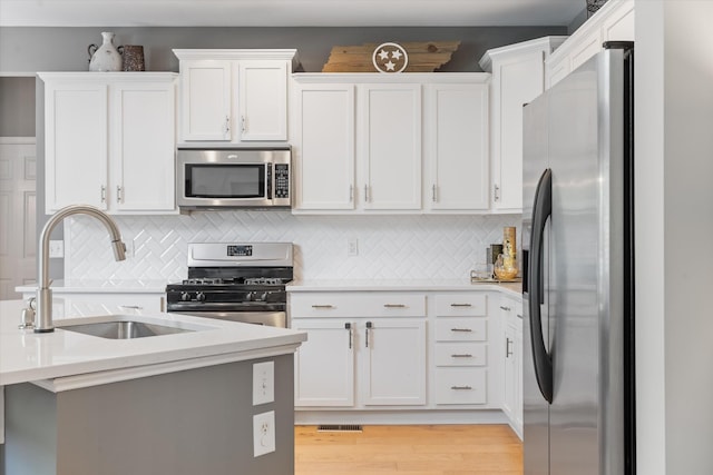 736 Arbor Springs Dr, Mount Juliet, TN 37122 - kitchen featuring appliances with stainless steel finishes, light countertops, and white cabinetry