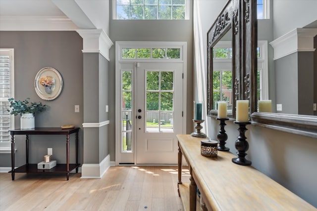 736 Arbor Springs Dr, Mount Juliet, TN 37122 - foyer entrance with ornate columns, light wood-type flooring, a towering ceiling, and baseboards