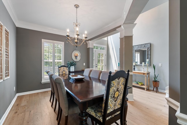 736 Arbor Springs Dr, Mount Juliet, TN 37122 - dining space with light wood-type flooring, decorative columns, crown molding, a chandelier, and baseboards