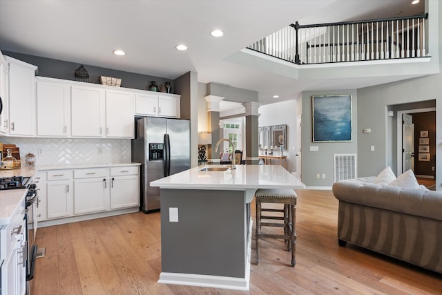 736 Arbor Springs Dr, Mount Juliet, TN 37122 - kitchen with stainless steel appliances, open floor plan, light wood finished floors, light countertops, and recessed lighting