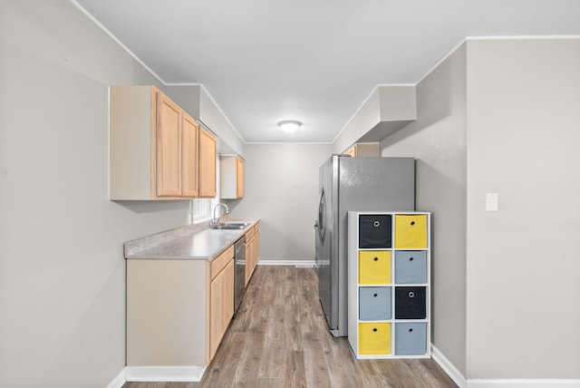 123 Koffman Dr, Hopkinsville, KY 42240 - kitchen with light brown cabinetry, baseboards, light wood-style floors, and dishwasher
