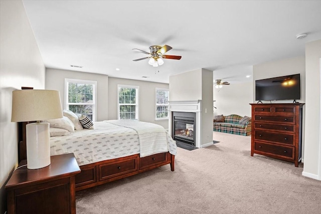 2740 Alvin Sperry Pass, Mount Juliet, TN 37122 - bedroom with light carpet, a glass covered fireplace, baseboards, and a ceiling fan