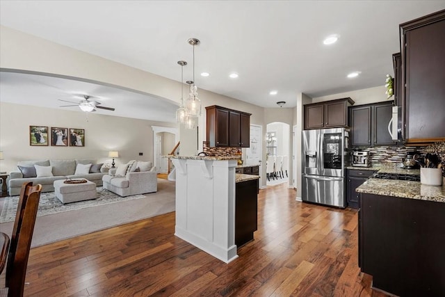 2740 Alvin Sperry Pass, Mount Juliet, TN 37122 - kitchen featuring stainless steel appliances, arched walkways, open floor plan, ceiling fan, and recessed lighting