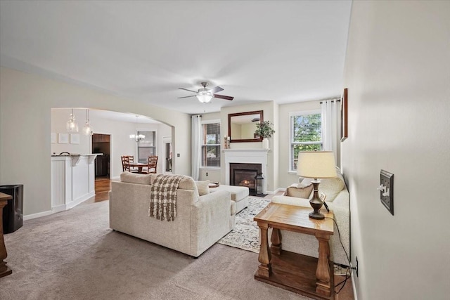 2740 Alvin Sperry Pass, Mount Juliet, TN 37122 - living area with ceiling fan, arched walkways, a glass covered fireplace, baseboards, and carpet