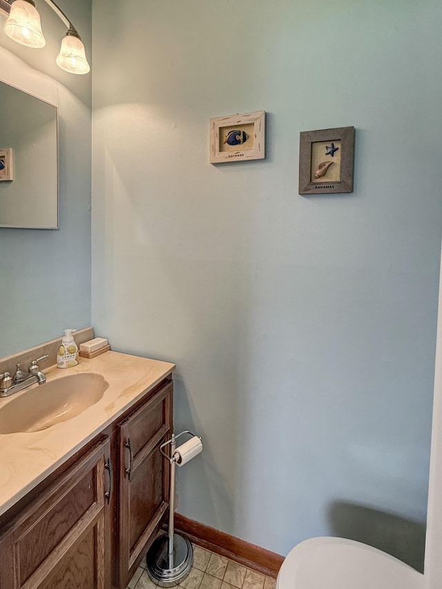 3113 Stafford Dr, Nashville, TN 37214 - half bathroom featuring vanity, toilet, baseboards, and tile patterned flooring