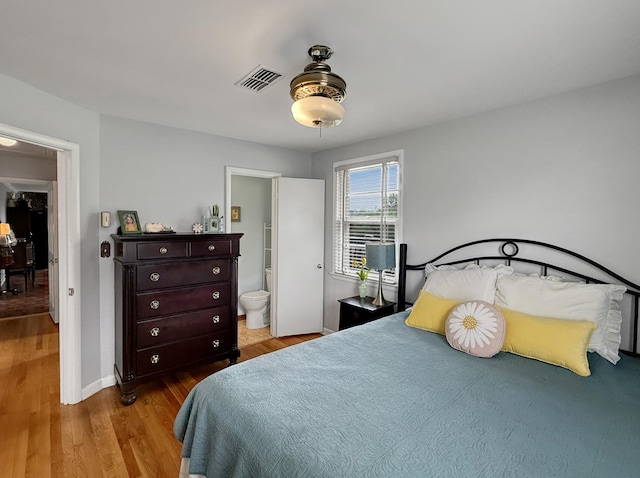 3113 Stafford Dr, Nashville, TN 37214 - bedroom featuring wood finished floors, ensuite bath, and baseboards