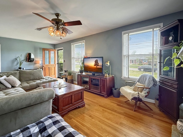 3113 Stafford Dr, Nashville, TN 37214 - living room featuring healthy amount of natural light, light wood-style flooring, and a ceiling fan