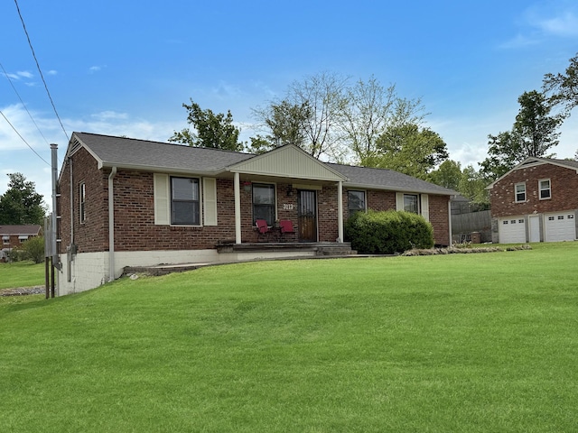 3113 Stafford Dr, Nashville, TN 37214 - view of front of property featuring a front lawn, brick siding, a detached garage, and covered porch