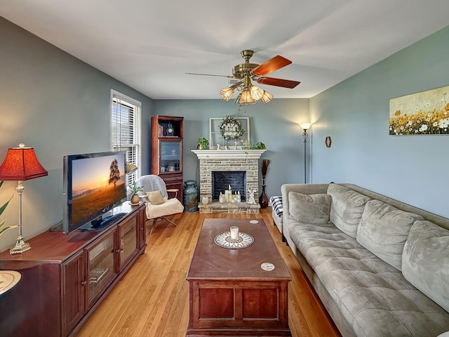 3113 Stafford Dr, Nashville, TN 37214 - living room with a ceiling fan, light wood-style flooring, and a stone fireplace