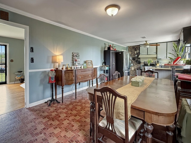 3113 Stafford Dr, Nashville, TN 37214 - dining area with brick patterned flooring, crown molding, ceiling fan, and baseboards