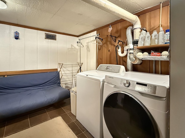 3113 Stafford Dr, Nashville, TN 37214 - washroom with washing machine and dryer and dark tile patterned flooring