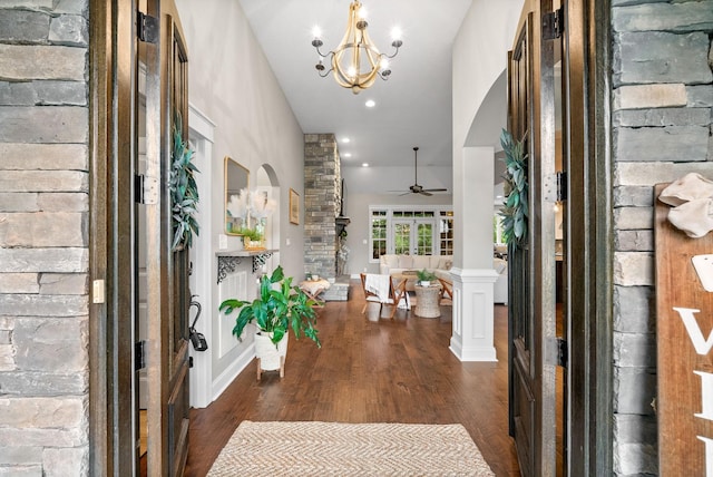 982 Red Bluff Way, Adams, TN 37010 - foyer entrance featuring arched walkways, wood finished floors, a ceiling fan, ornate columns, and a chandelier