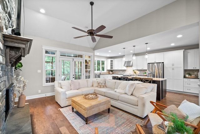 982 Red Bluff Way, Adams, TN 37010 - living room with dark wood finished floors, a stone fireplace, ceiling fan, baseboards, and recessed lighting