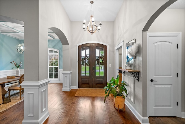982 Red Bluff Way, Adams, TN 37010 - entrance foyer featuring arched walkways, a chandelier, dark wood-type flooring, and a towering ceiling