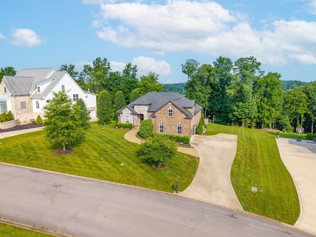 982 Red Bluff Way, Adams, TN 37010 - view of front of house with concrete driveway, a front yard, and stone siding