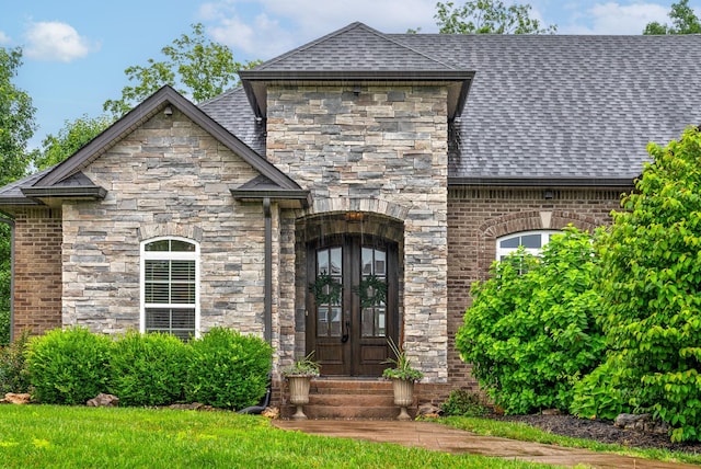 982 Red Bluff Way, Adams, TN 37010 - view of front of house with french doors, stone siding, entry steps, and roof with shingles