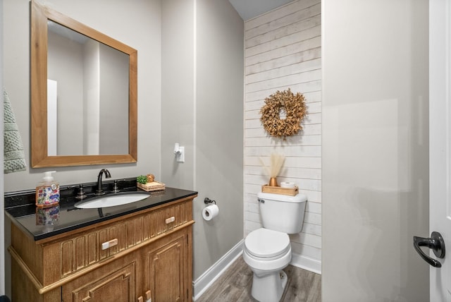 982 Red Bluff Way, Adams, TN 37010 - bathroom with toilet, wood finished floors, baseboards, and vanity