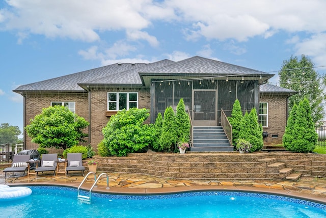982 Red Bluff Way, Adams, TN 37010 - back of house with roof with shingles, brick siding, a sunroom, and stairs