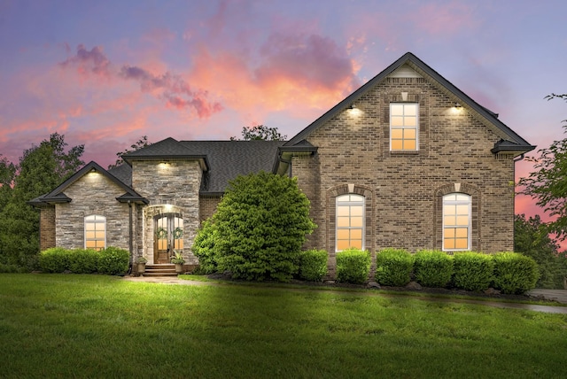 982 Red Bluff Way, Adams, TN 37010 - french country inspired facade featuring a lawn and brick siding