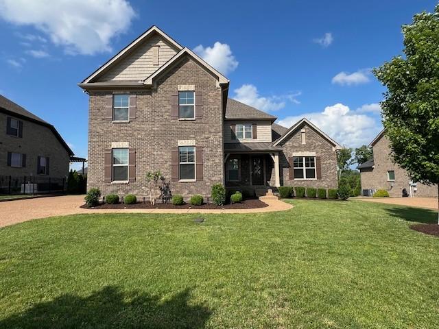 110 Sperance Ln, Gallatin, TN 37066 - craftsman-style house with brick siding and a front lawn