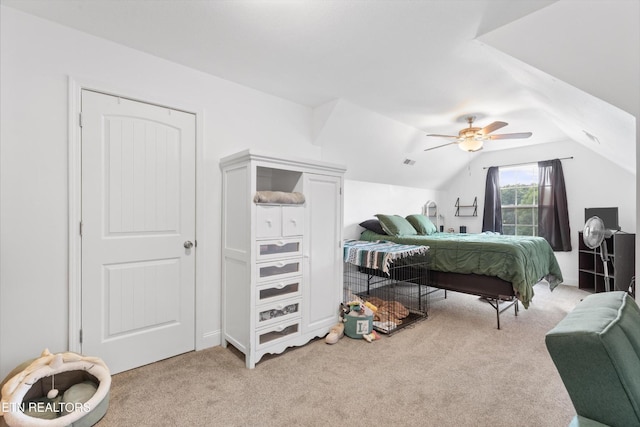 241 Hillside Ln, Lenoir City, TN 37771 - bedroom featuring light colored carpet, vaulted ceiling, and ceiling fan