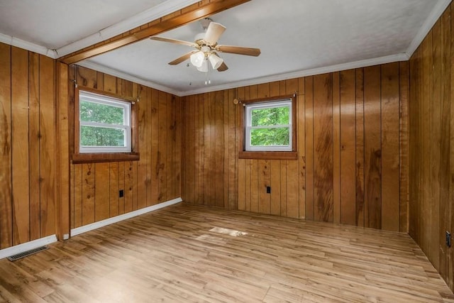 852 Eastland Rd, Sparta, TN 38583 - unfurnished room with wood finished floors, a ceiling fan, wood walls, and crown molding