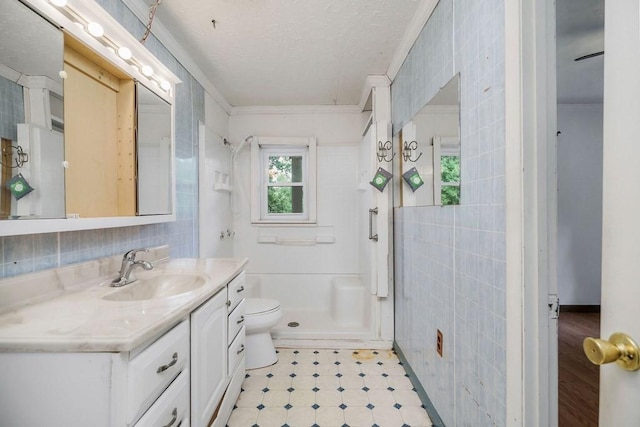 852 Eastland Rd, Sparta, TN 38583 - full bath featuring tile walls, vanity, crown molding, a shower, and toilet