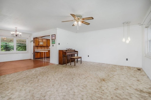 852 Eastland Rd, Sparta, TN 38583 - living area with a chandelier, carpet flooring, and a ceiling fan