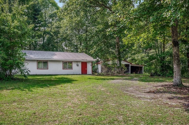 852 Eastland Rd, Sparta, TN 38583 - view of front of house with a front yard and metal roof