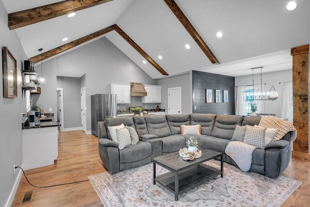 1270 Post Oak Rd, Belvidere, TN 37306 - living area featuring a chandelier, baseboards, beam ceiling, light wood-style floors, and recessed lighting