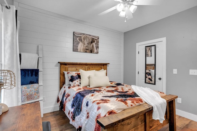 1270 Post Oak Rd, Belvidere, TN 37306 - bedroom with wood finished floors, wooden walls, baseboards, and ceiling fan