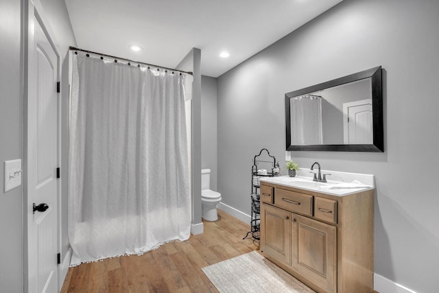 1270 Post Oak Rd, Belvidere, TN 37306 - bathroom featuring vanity, toilet, baseboards, wood finished floors, and recessed lighting