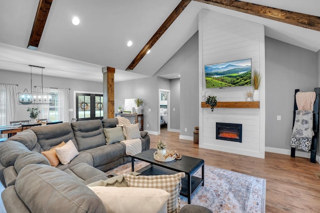 1270 Post Oak Rd, Belvidere, TN 37306 - living room with beamed ceiling, high vaulted ceiling, baseboards, a large fireplace, and light wood-type flooring