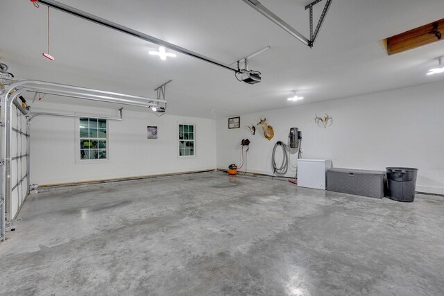 1270 Post Oak Rd, Belvidere, TN 37306 - garage with a garage door opener and a central vacuum unit