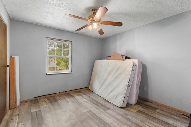 210 Welch Rd, Tazewell, TN 37879 - bedroom with a textured ceiling, wood finished floors, and ceiling fan
