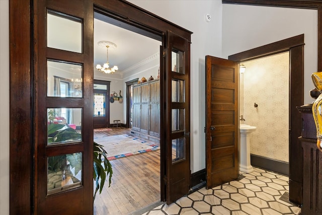 207 Main St E, Wartrace, TN 37183 - foyer entrance featuring crown molding, a chandelier, and baseboards
