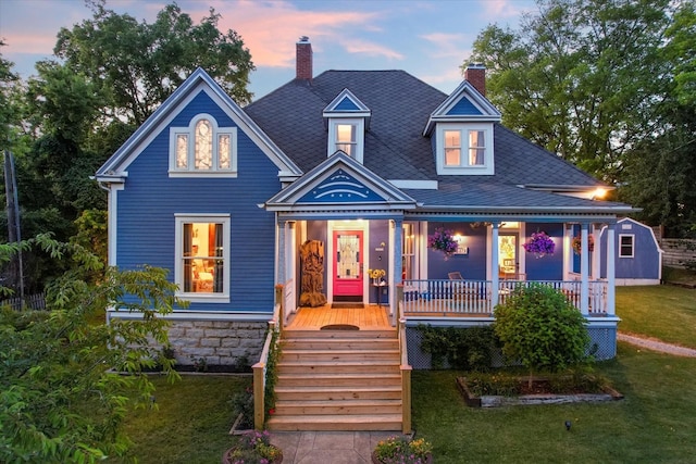 207 Main St E, Wartrace, TN 37183 - victorian home featuring covered porch, a front yard, a chimney, and a shingled roof
