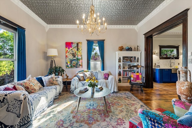 207 Main St E, Wartrace, TN 37183 - living room featuring crown molding, hardwood / wood-style flooring, a chandelier, and an ornate ceiling