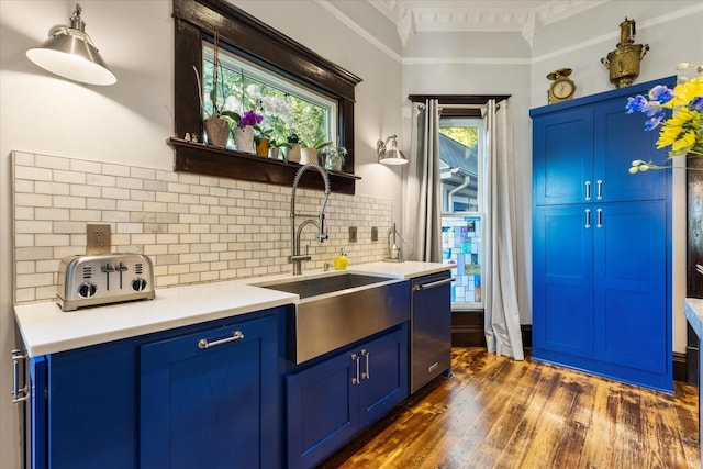 207 Main St E, Wartrace, TN 37183 - kitchen featuring blue cabinets, stainless steel dishwasher, ornamental molding, a sink, and dark wood-type flooring