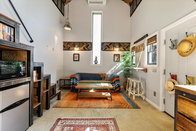 207 Main St E, Wartrace, TN 37183 - living area featuring a towering ceiling, carpet flooring, and baseboards
