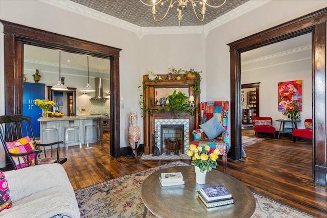 207 Main St E, Wartrace, TN 37183 - living area with hardwood / wood-style flooring, crown molding, a premium fireplace, a chandelier, and an ornate ceiling