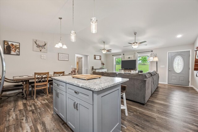 439 Ferry Bend Trl, Crossville, TN 38571 - kitchen with gray cabinetry, dark wood-style flooring, a kitchen island, a kitchen breakfast bar, and ceiling fan