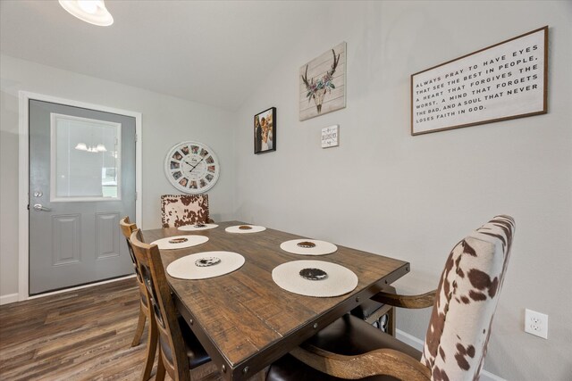 439 Ferry Bend Trl, Crossville, TN 38571 - dining area featuring wood finished floors, vaulted ceiling, and baseboards