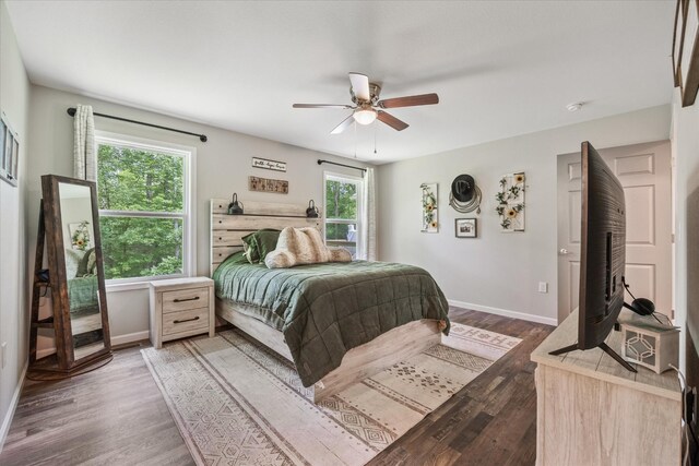 439 Ferry Bend Trl, Crossville, TN 38571 - bedroom featuring baseboards, wood finished floors, and a ceiling fan