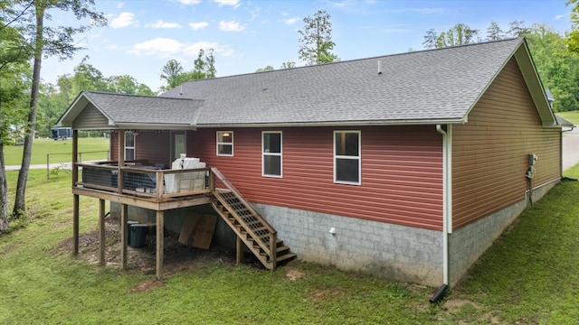 439 Ferry Bend Trl, Crossville, TN 38571 - rear view of house featuring a lawn, a deck, stairs, and a shingled roof