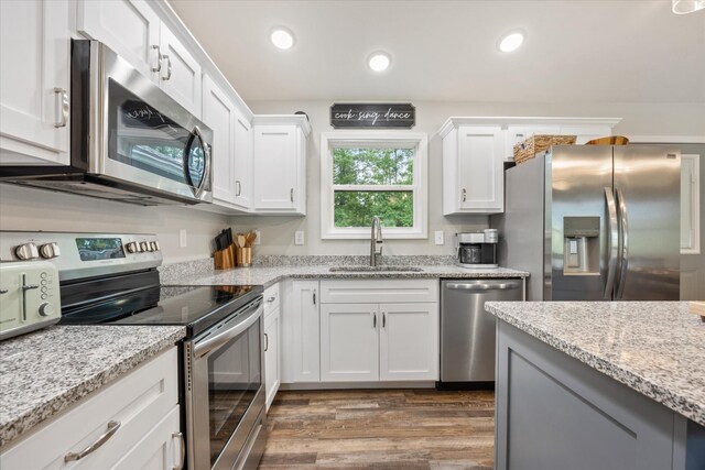 439 Ferry Bend Trl, Crossville, TN 38571 - kitchen featuring appliances with stainless steel finishes, a sink, dark wood-type flooring, white cabinets, and recessed lighting