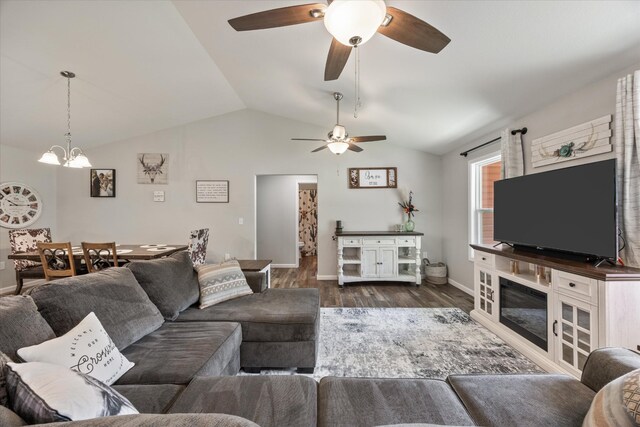 439 Ferry Bend Trl, Crossville, TN 38571 - living area featuring a ceiling fan, vaulted ceiling, dark wood finished floors, baseboards, and a chandelier