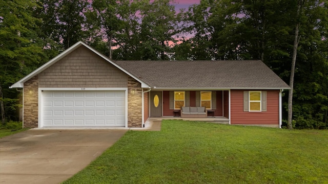 439 Ferry Bend Trl, Crossville, TN 38571 - ranch-style house with covered porch, concrete driveway, an attached garage, a lawn, and a shingled roof