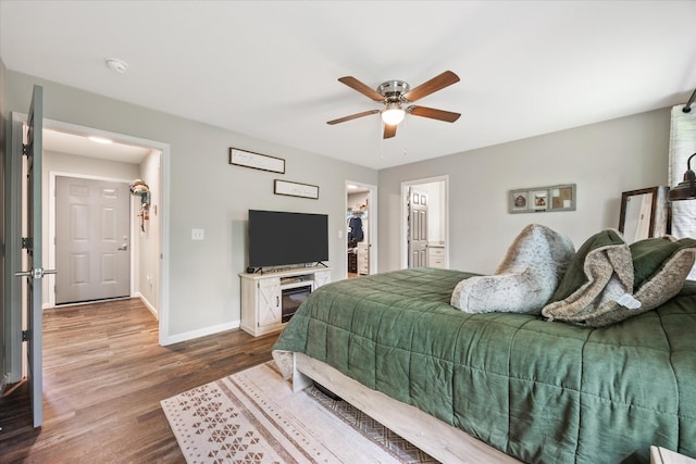 439 Ferry Bend Trl, Crossville, TN 38571 - bedroom with wood finished floors, baseboards, a spacious closet, and a ceiling fan