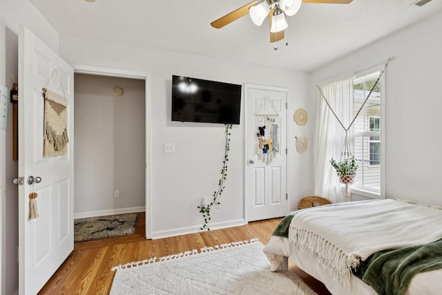 123 Hubbard St, Hohenwald, TN 38462 - bedroom with light wood-type flooring, baseboards, and ceiling fan